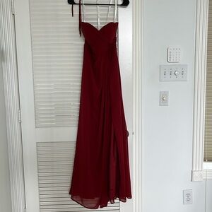 Red bridesmaid dress tailored for person 5’ 3” wearing heels
